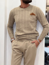 MAGLIA TRECCIA CON TASCHINO E POSCHETTE